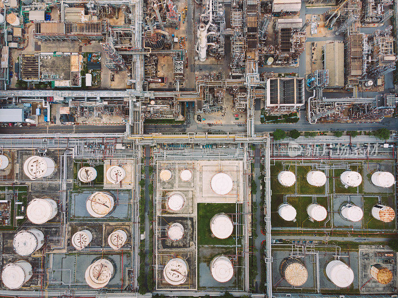 Oil and Gas Industrial aera from above bird eye view ,The equipment of oil refining , Close-up shot by drone of industrial pipelines of an oil-refinery plant,Detail of oil pipeline with valves in large oil refinery.